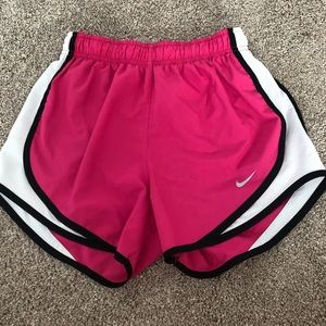 Pink, white, and black athletic shorts